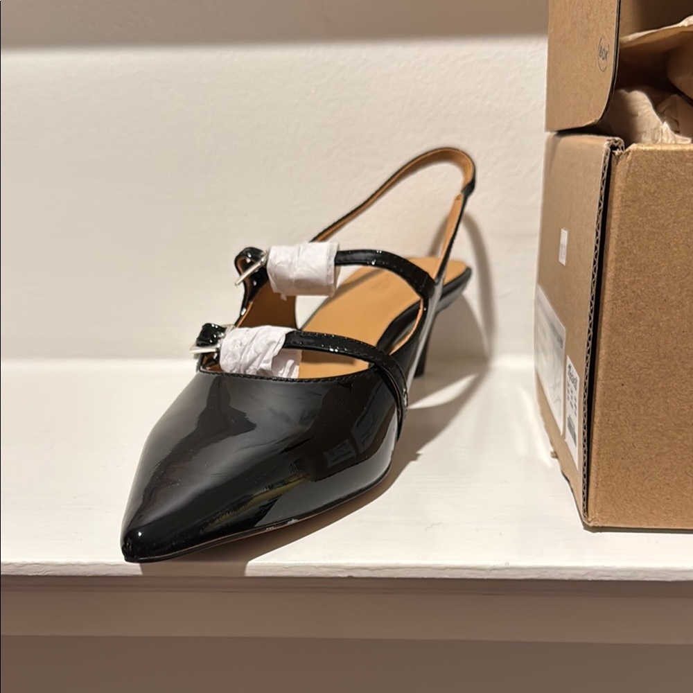 Madewell pointy toes sling backs in patent leather.